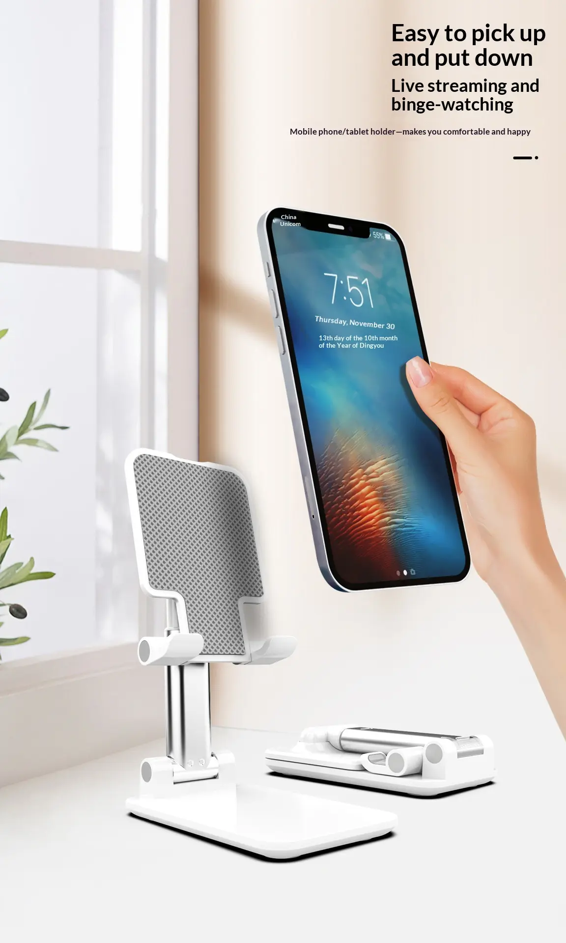 Adjustable and foldable white desktop mobile phone stand with anti-slip pad and telescopic arm.