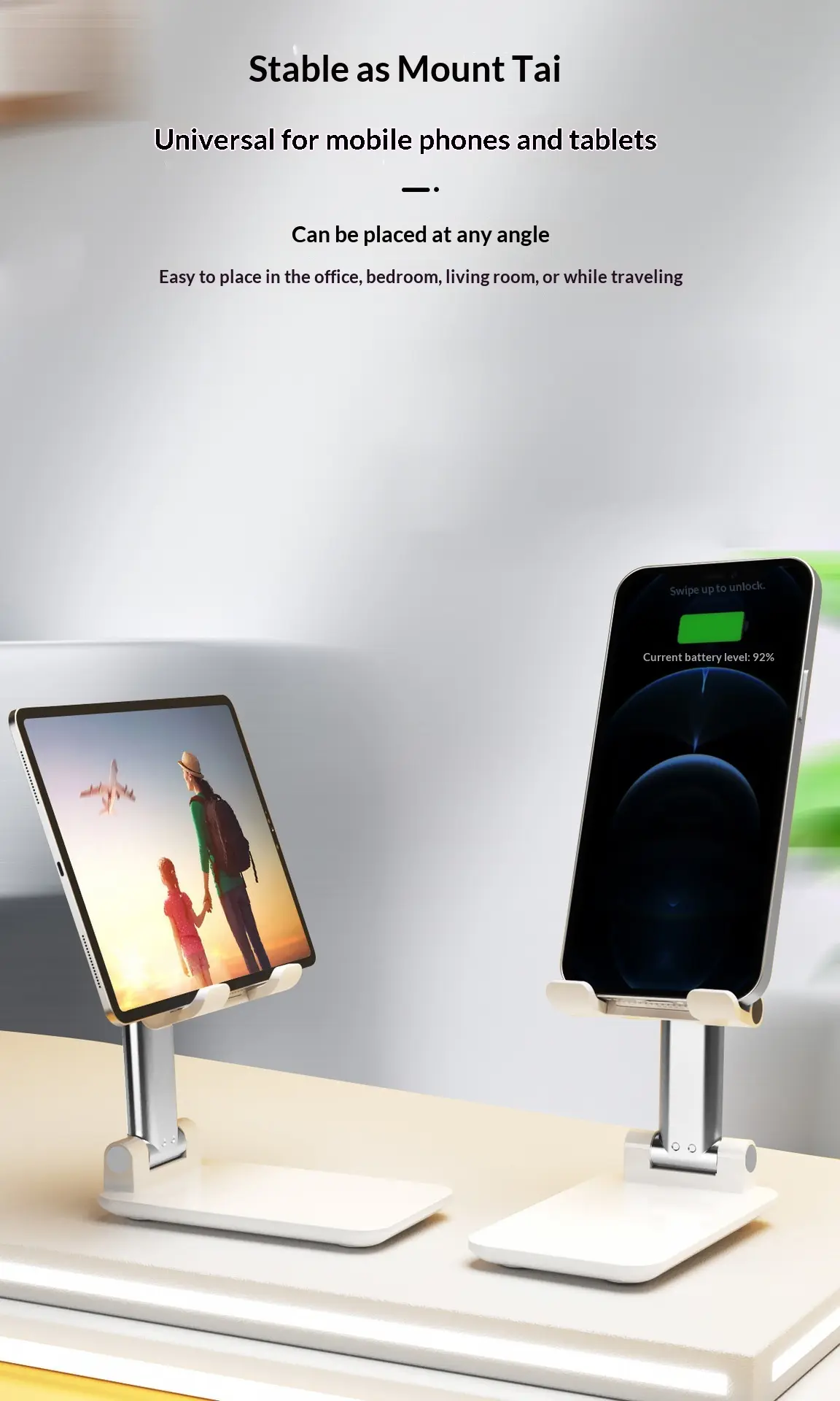 Adjustable and foldable white desktop mobile phone stand with anti-slip pad and telescopic arm.