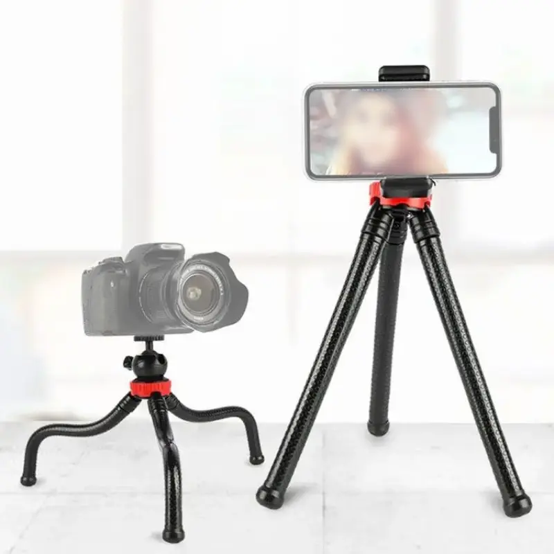 Flexible octopus tripod stand supporting a DSLR camera and a smartphone