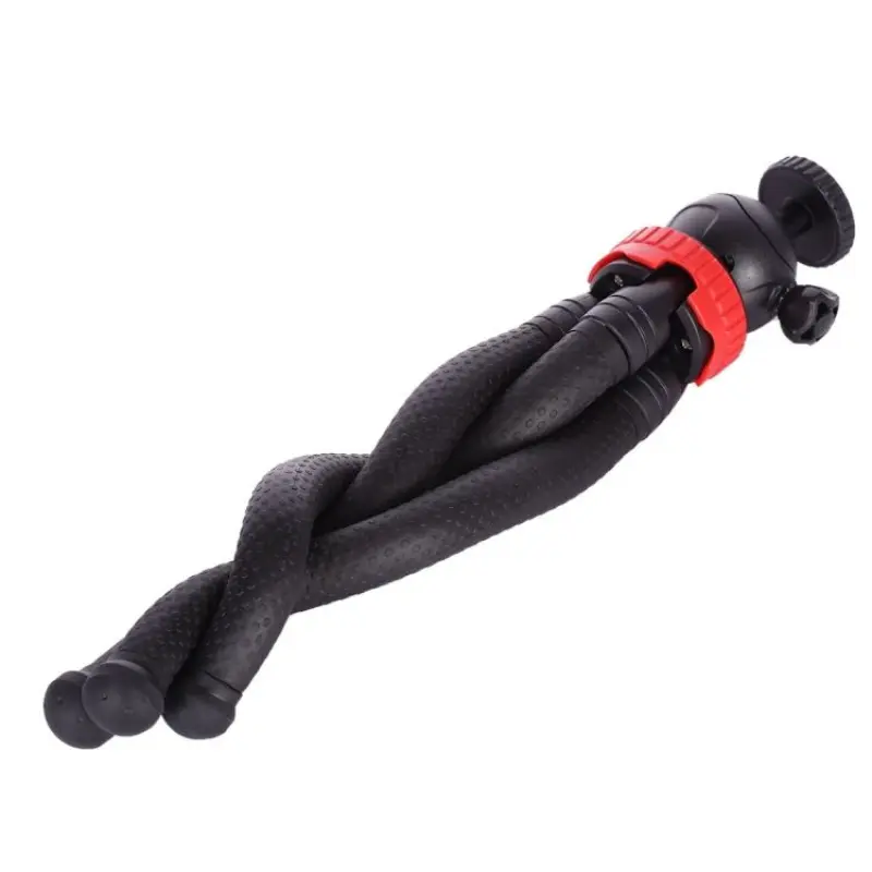 Flexible octopus tripod stand supporting a DSLR camera and a smartphone